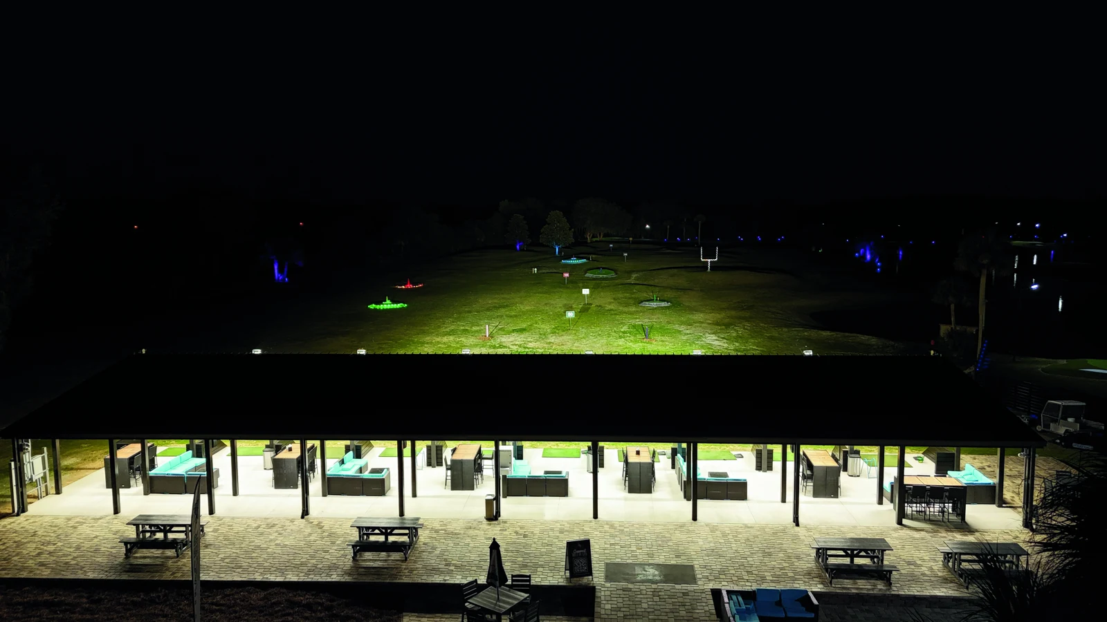 The line of covered Toptracer bays overlooking the illuminated ZenWoods range